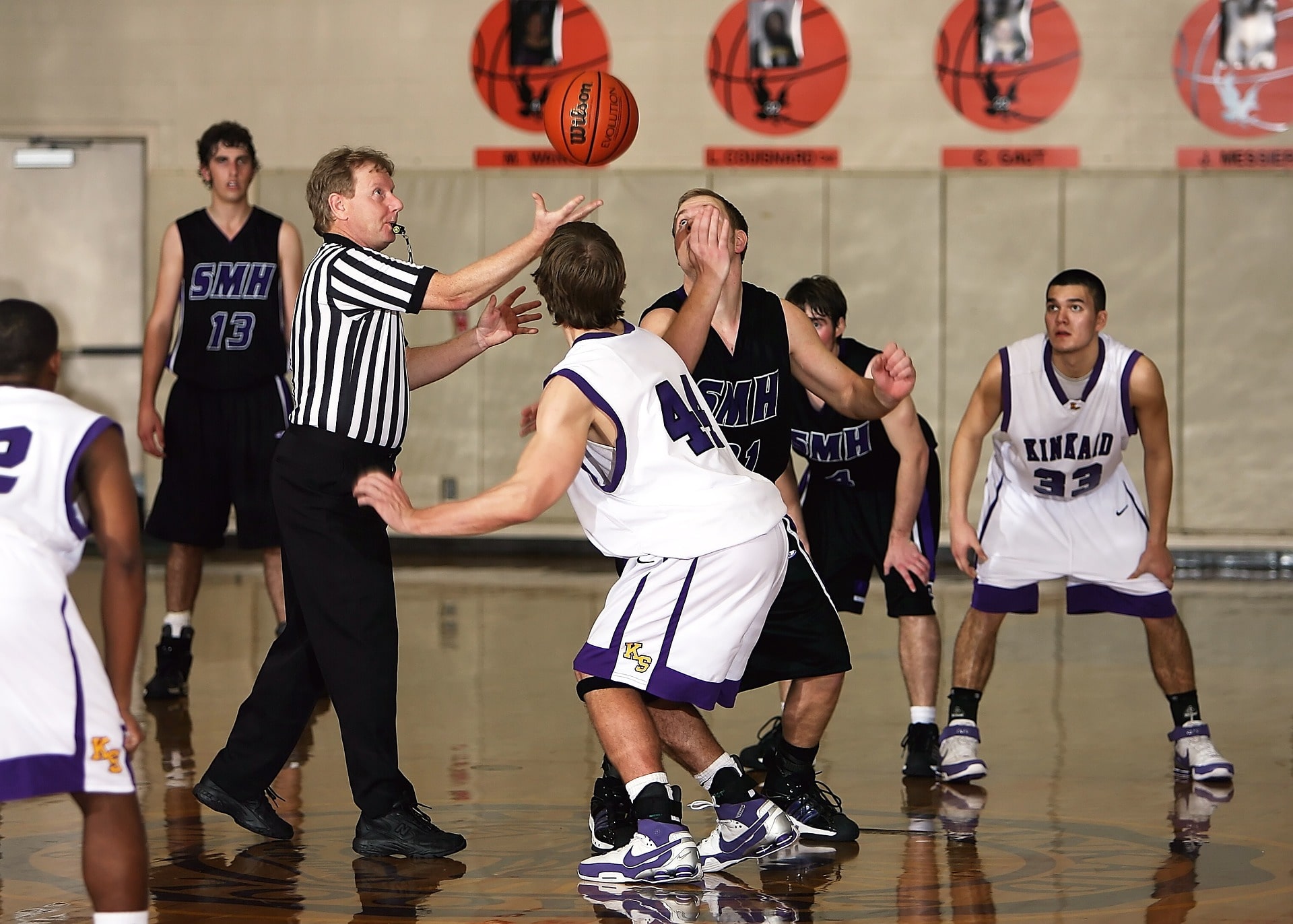 Images of Tip Off at a Boys Basketball Game