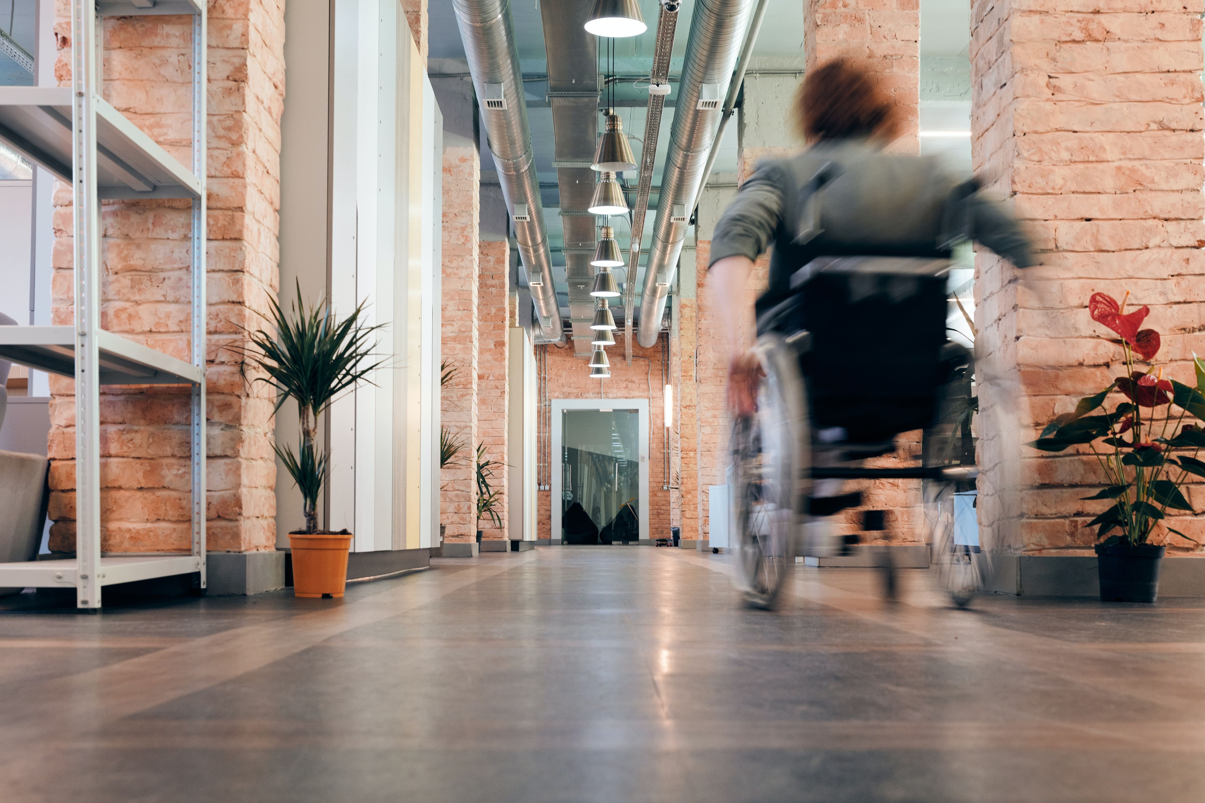 Image of employee in a wheelchair at an office